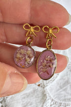 Boucles d'oreilles pendantes asymétriques - Nœuds roses